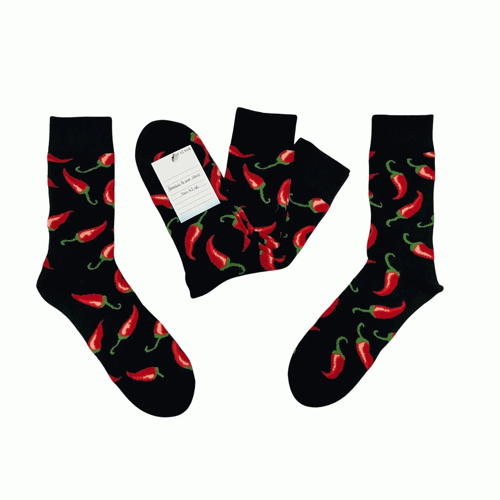 Flat lay of men’s bamboo socks with red chilli print. Soft, breathable and perfect as a fun gift or everyday standout pair.