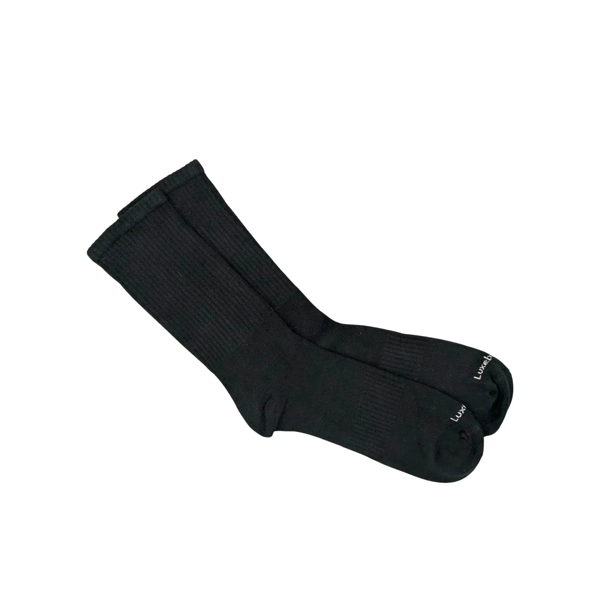 Pair of black bamboo socks with the logo Luxebamboo on a white background