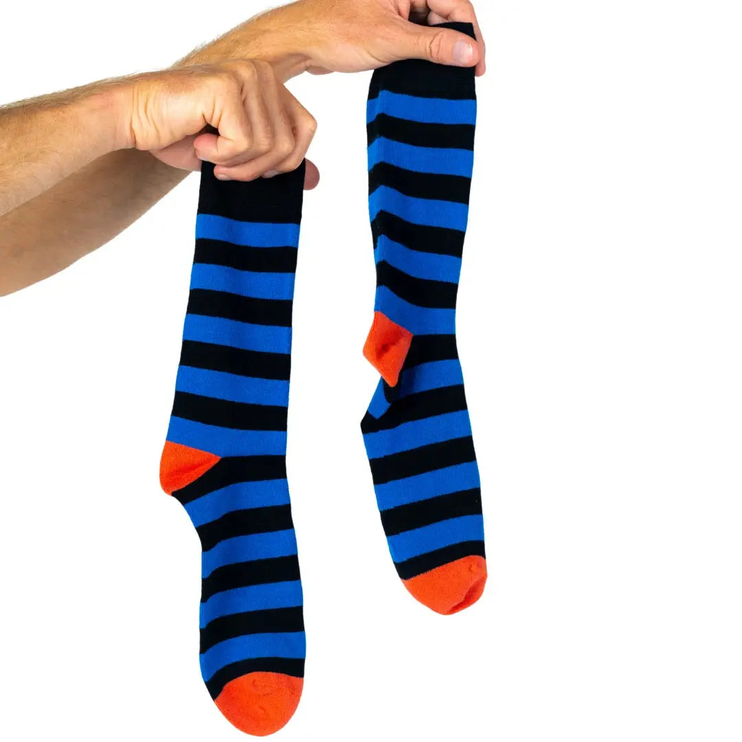 Pair of striped bamboo socks held in hand. Soft, breathable and ideal for everyday wear or gifting.